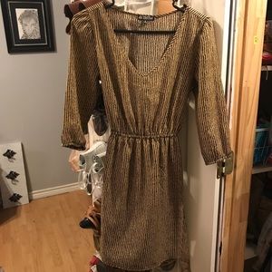 Pinned striped brown and black dress